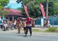 Bhabinkamtibmas Polsek Kuala Hadir di Jam Sekolah, Bantu Pelajar Menyeberang