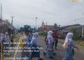Polisi Hadir di Jam Sibuk, Bhabinkamtibmas Polsek Kuala Bantu Siswa Menyeberang Jalan